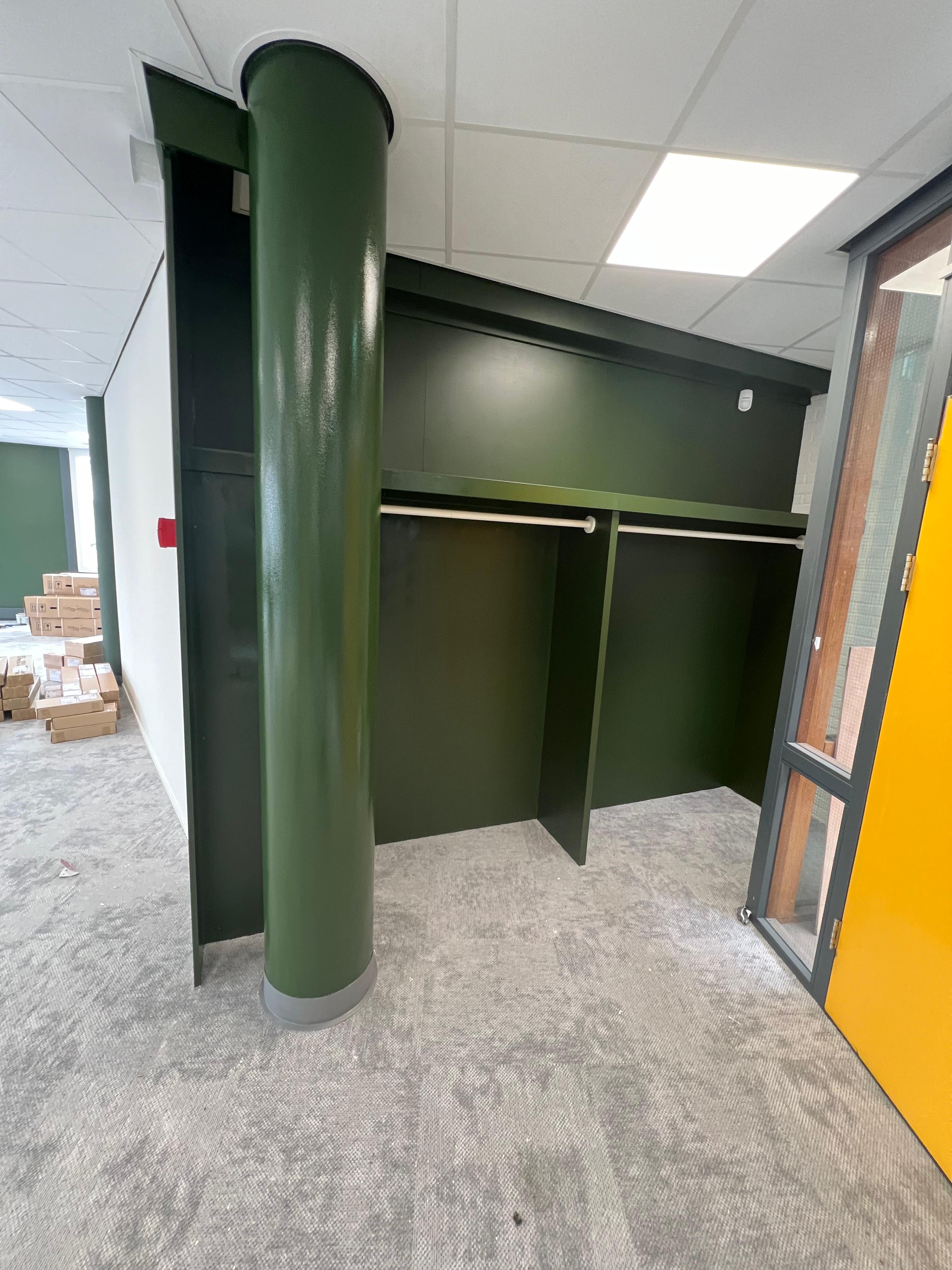 Painted black spiral staircase in commercial office space